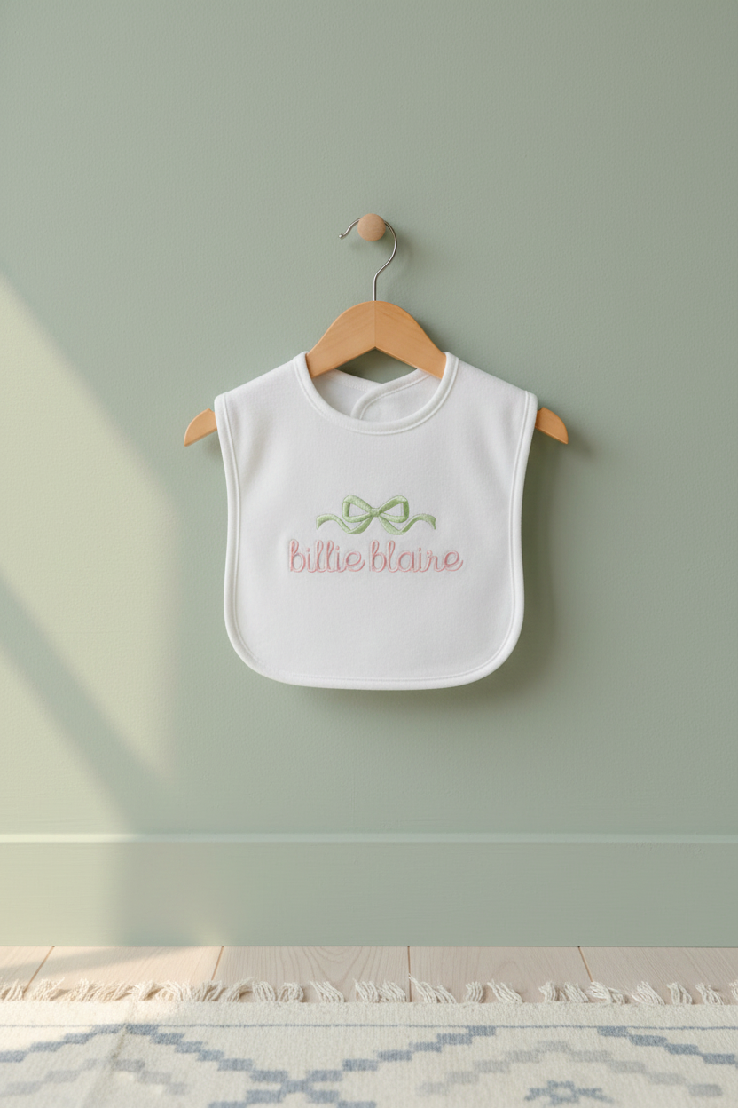 Baby bib with embroidered bow - hanging style