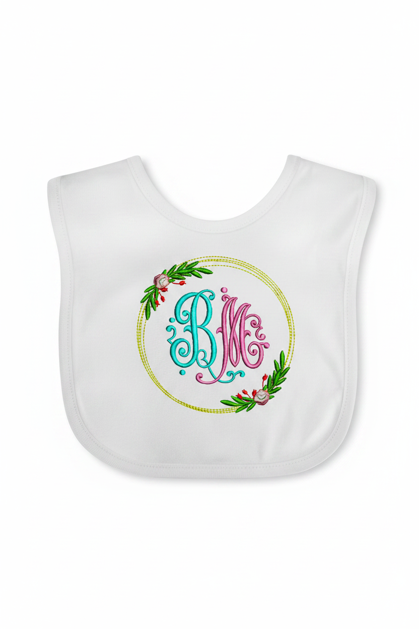 Embroidered floral monogram BM on baby bib