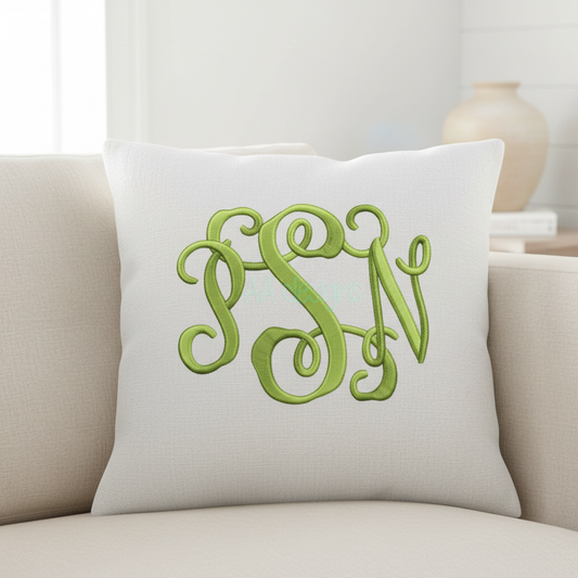 Embroidered interlocking monogram PSN on decorative pillow
